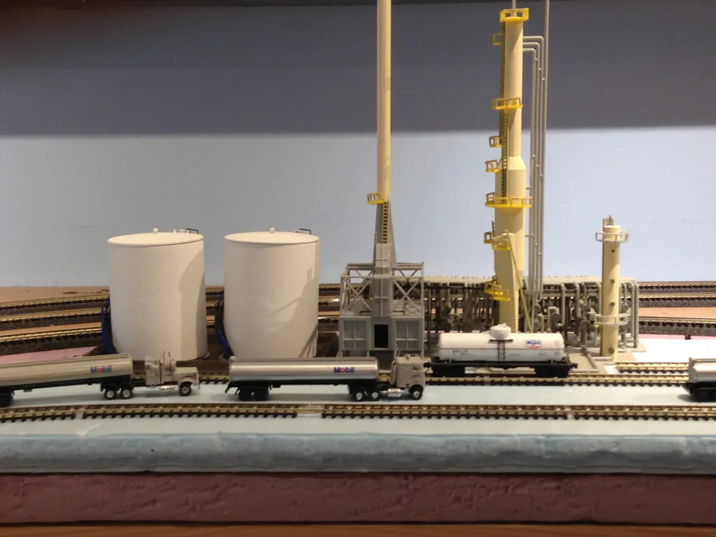 N scale refinery and tank cars and trucks on Jim's GMM CN&W themed layout.